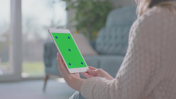 Young Woman watching movie on tablet