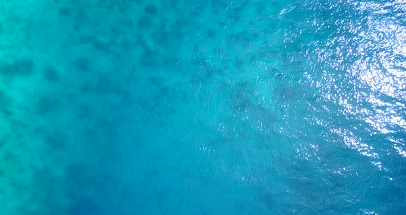 Wide drone copy space shot of a summer white paradise sand beach and aqua blue water background in h