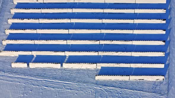 Snowy photovoltaic farm in winter. Green energy in Poland.