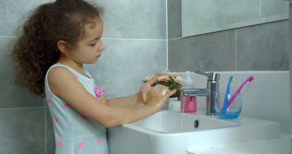 Portrait Happy Cute Young Teenage Girl Brushing Teeth in Bathroom and Smiling