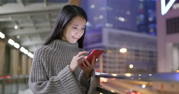 Asian woman use of smart phone at night