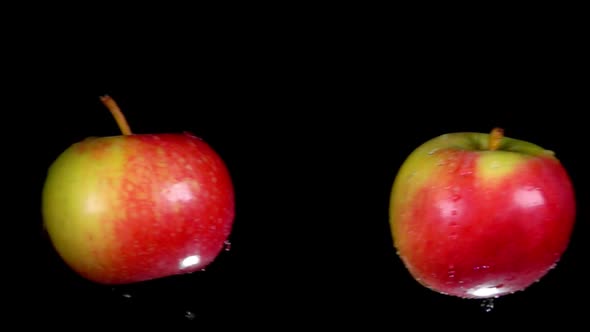 Two Wet Red-green Apples Collide with Each Other