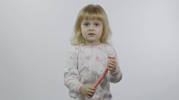 Kid Playing with Hand Made Toy Slime. Child Having Fun Making Pink Slime