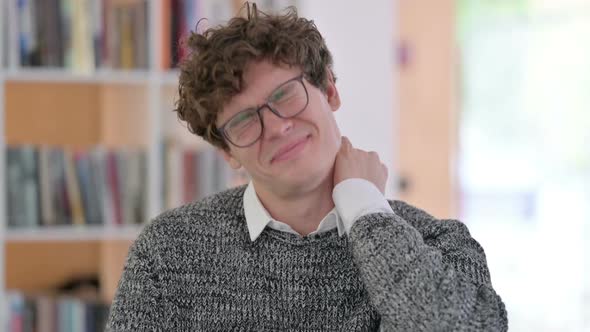 Portrait of Tired Young Man Having Neck Pain