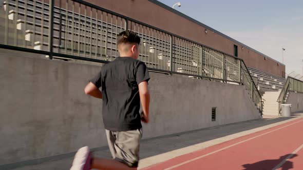 Boy Running On School Track