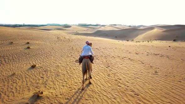 Aerial Survey Drone Flies Over Bedouin, Which Goes Through the Desert