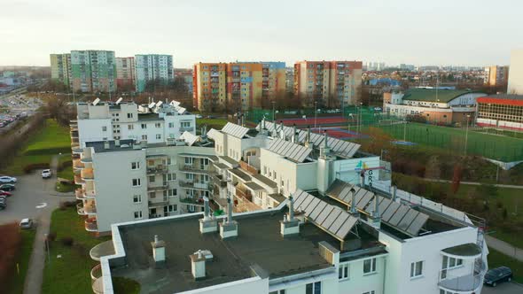 Drone Shot on Modern Multiapartment Buildings with Solar Panels on the Roofs