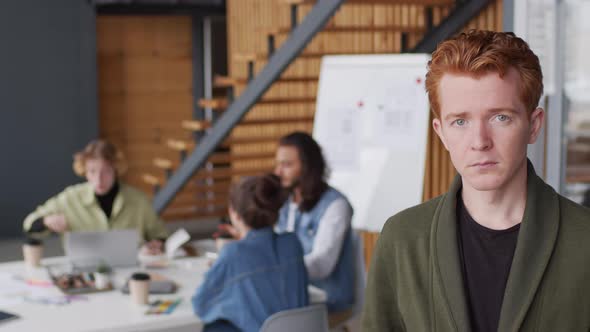 Portrait of Young Businessman in Modern Office