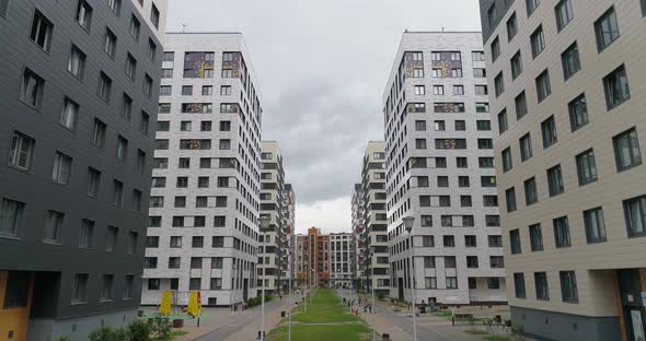 Aerial View of Modern Residential Area of City with Walking People