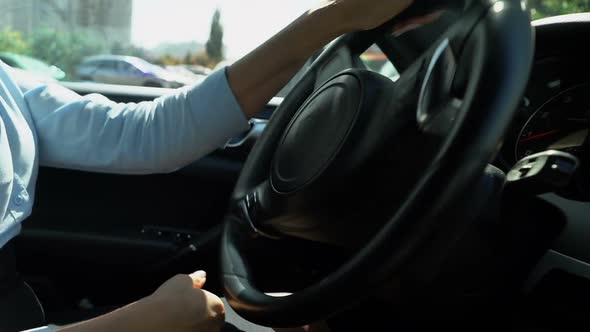 Female Driving Car Back Into Parking Spot, Attentive Driver Closeup Reverse Gear