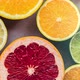 Motion Background Of Citrus Fruit In Colorful Arrangement - VideoHive Item for Sale