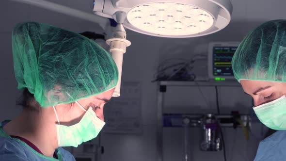 Women Performing Surgery In Hospital Together