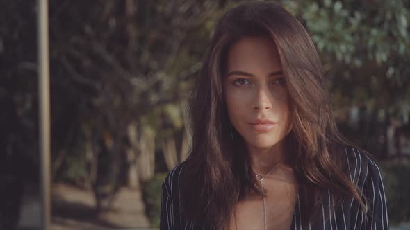 Stunning Woman with Fresh Freckled Skin Looks Into Camera