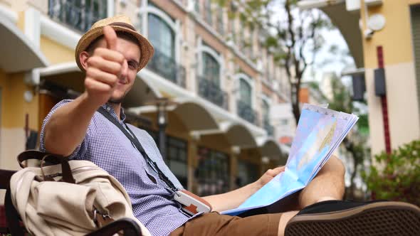 Tourist Man Portrait In Hipster Hat Sightseeing With Map