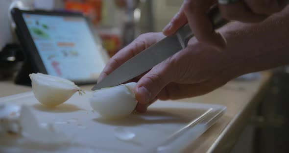 Man cooking with tablet slow motion