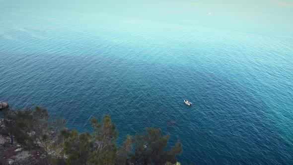 Small white speed boat floating in open sea