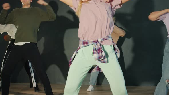 Portrait of Gifted Young People Practicing Creative Dance in Dark Room Enjoying Modern Moves