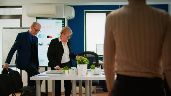 Business People Comming in Conference Room Ready for Morning Meeting