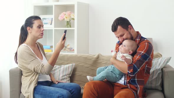 Happy Family with Baby Photographing at Home 