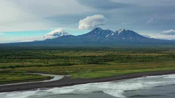 Beach with Black Sand and Volcano