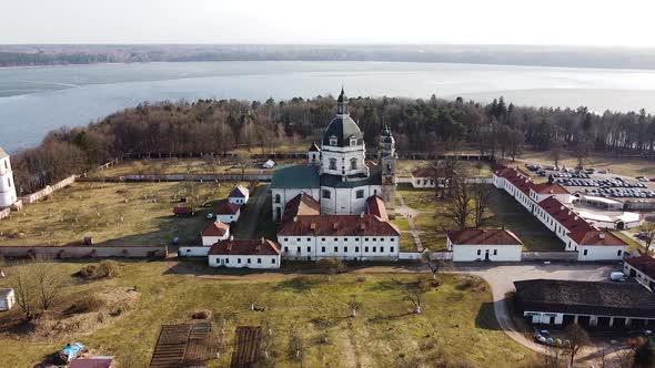 Pazaislis Monastery complex in aerial orbiting view of sunny day