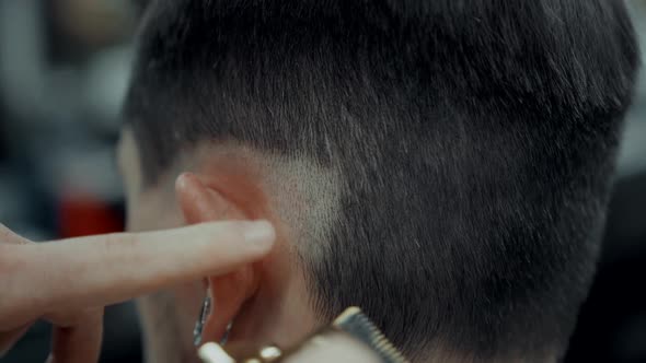 Man Getting A Haircut From A Barber