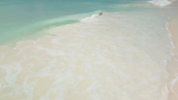 Sea Foam From The Waves On The Beach