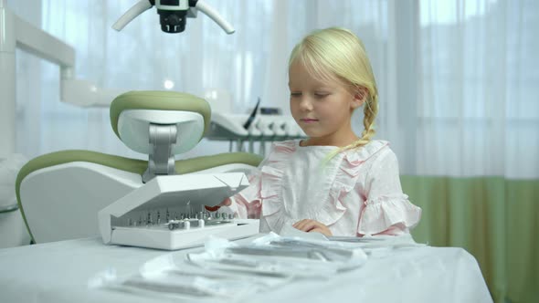 Little Girl Close the Box with Instruments