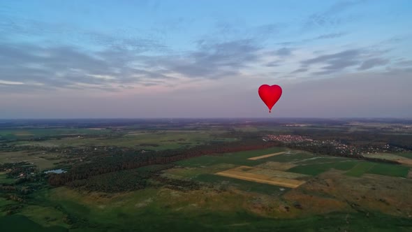 Red air balloon in love heart shape