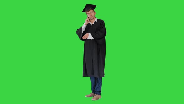 Male Graduate Gown Mortarboard Having Conversation Phone Green Screen Chroma Key