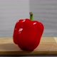 Bell pepper falls on a bamboo cutting board - VideoHive Item for Sale