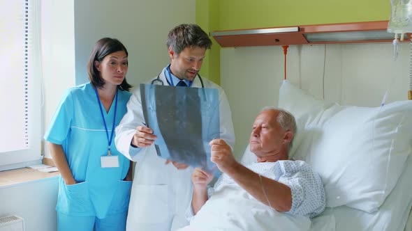 Doctor discussing x-ray with patient