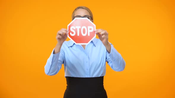 Serious Female Manager Showing Stop Sign, Equal Rights in Business, Restriction