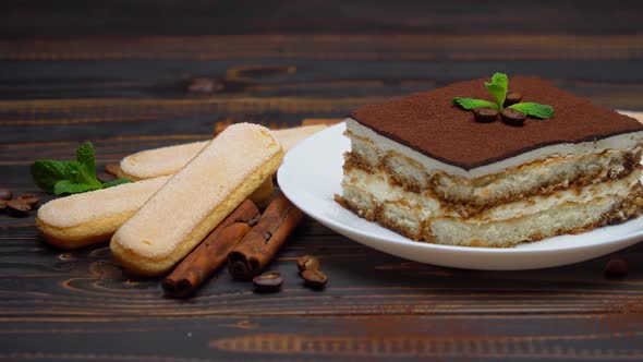 Portion of Traditional Italian Tiramisu Dessert Coffee Beans and Savoiardi Cookies