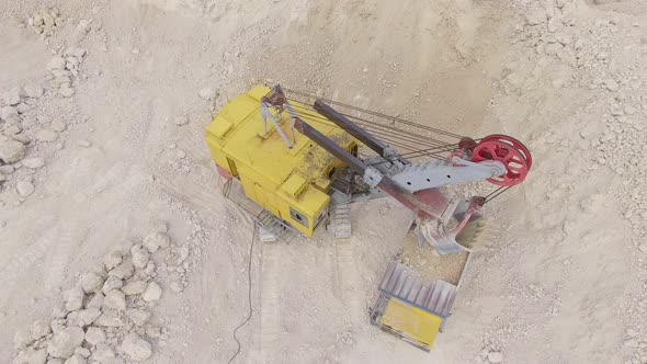 High angle of an excavator loading ballast