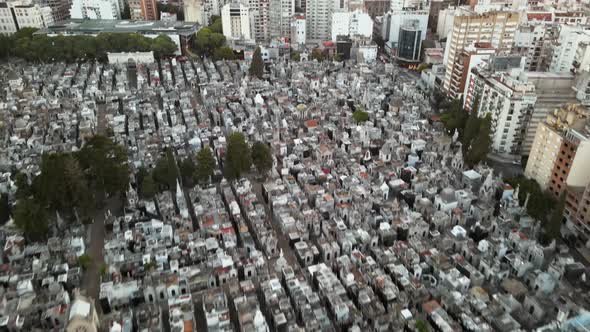 Aerial tilt up shot revealing La Recoleta Cemetery at sunset in Buenos Aires