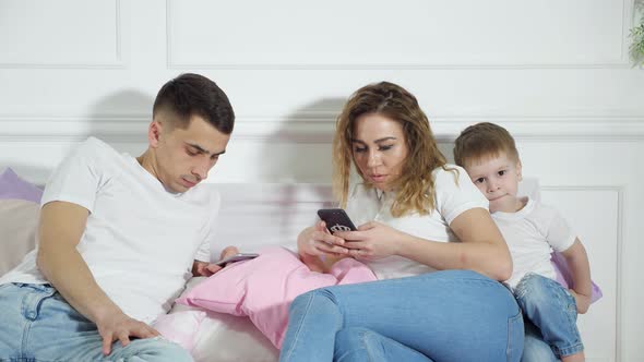 Parents Are Looking in Their Mobile Phones Not Paying Attention To Their Child, Escape of Reality