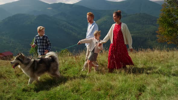 Family Dog Spending Holiday in Summer Mountains