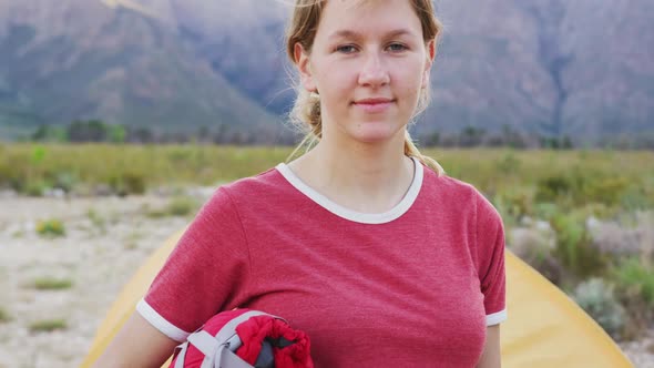 Caucasian woman looking at camera and smiling