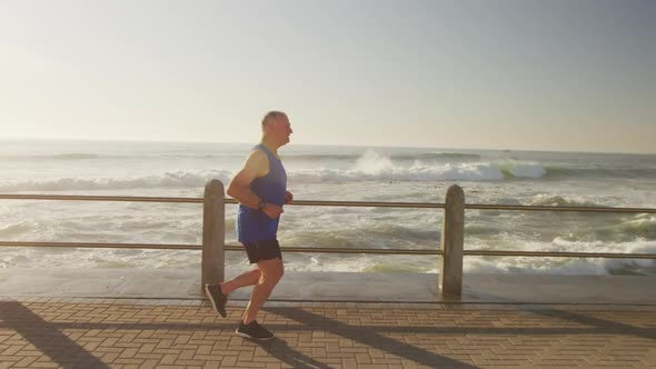 Senior man running on the promenade