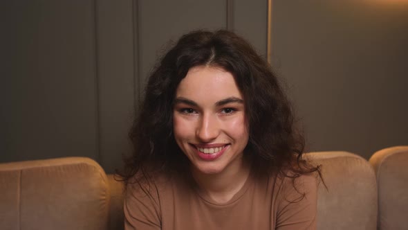 Confident Laughs Young Woman Looking at Camera Standing at Home Office