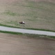 Aerial view, Farmer Drives Old Tractor Sow Buckwheat Seeds - VideoHive Item for Sale