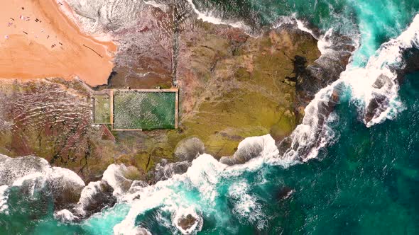 Aerial view above public swimming pool at Mona Vale Beach, Sydney, Australia.