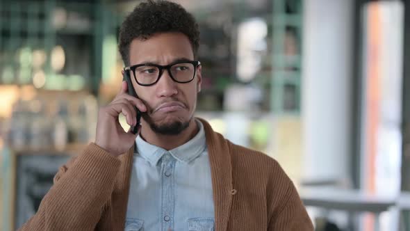 African Man Talking on Smartphone