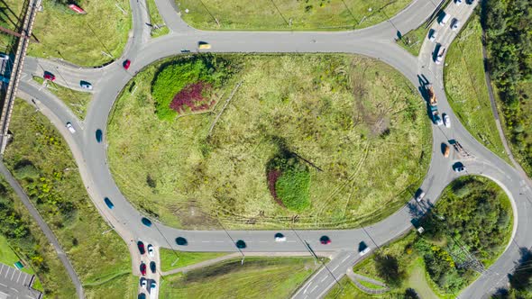Aerial timelapse of traffic on a roundabout in the UK