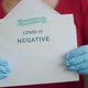 Woman Holding Negative Antigen Detection Test for Covid-19 - VideoHive Item for Sale