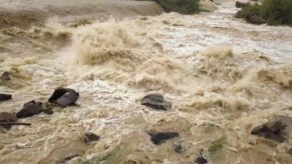 Eide dirty river with muddy water in flooding period during heavy rains in spring.