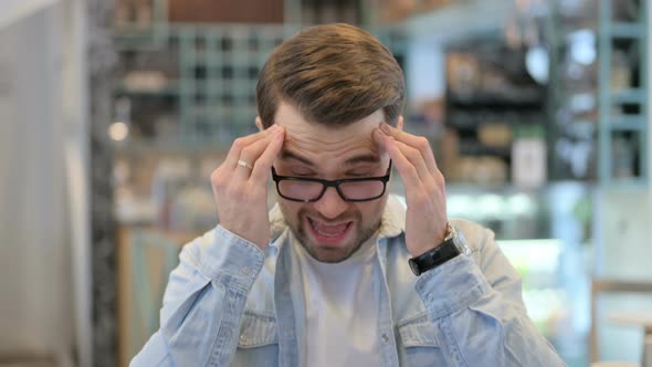 Young Man Having Headache