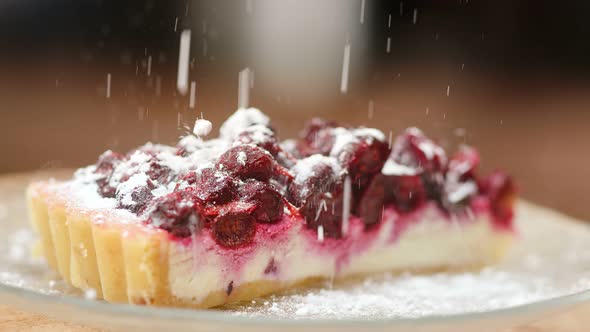 Sprinkle Sugar Powder on Rotating Cheesecake Slow Motion