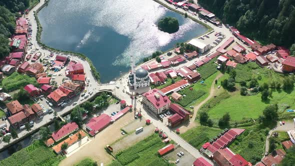 aerial drone circling over a mosque in a small village around the mountains of Uzungol Trabzon on a
